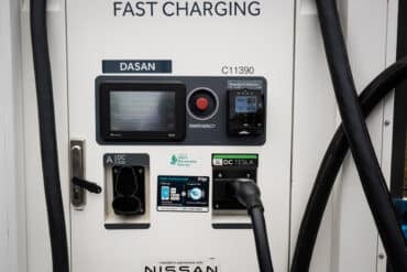 a fast charging ev charger station with both ccs and nacs plugs